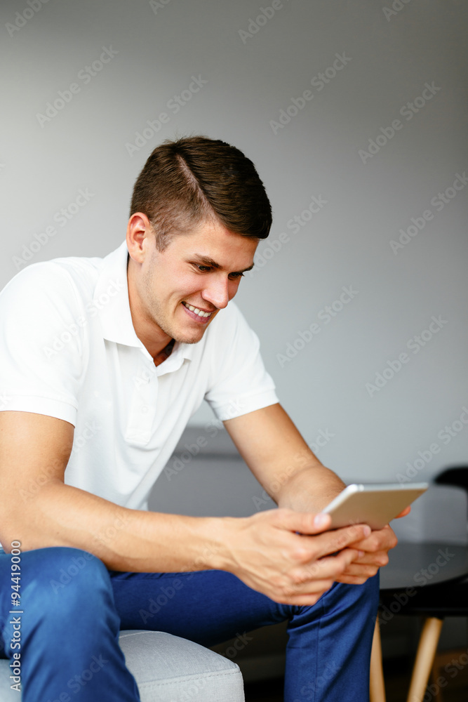 Man at home with digital tablet Man at home with digital tablet