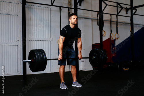 Young man during deadlift workout
