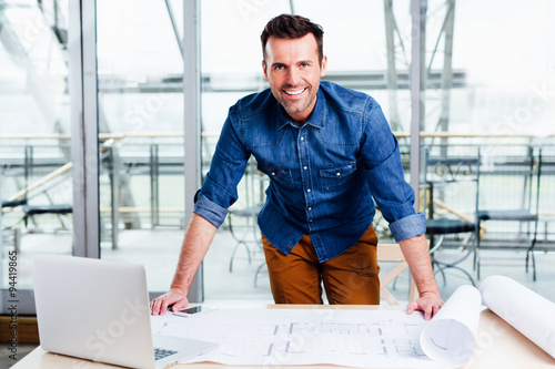 Successful architect and his design on paper