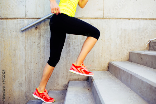 Fotografie Woman running up the stairs