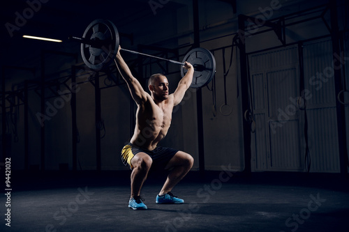 Squats with barbells over head