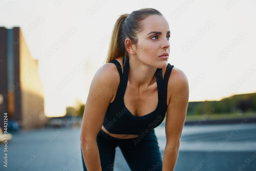Young woman resting after running exercise