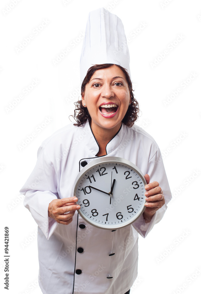 portrait of a mature cook woman holding a big clock portrait of a mature cook woman holding a big clock