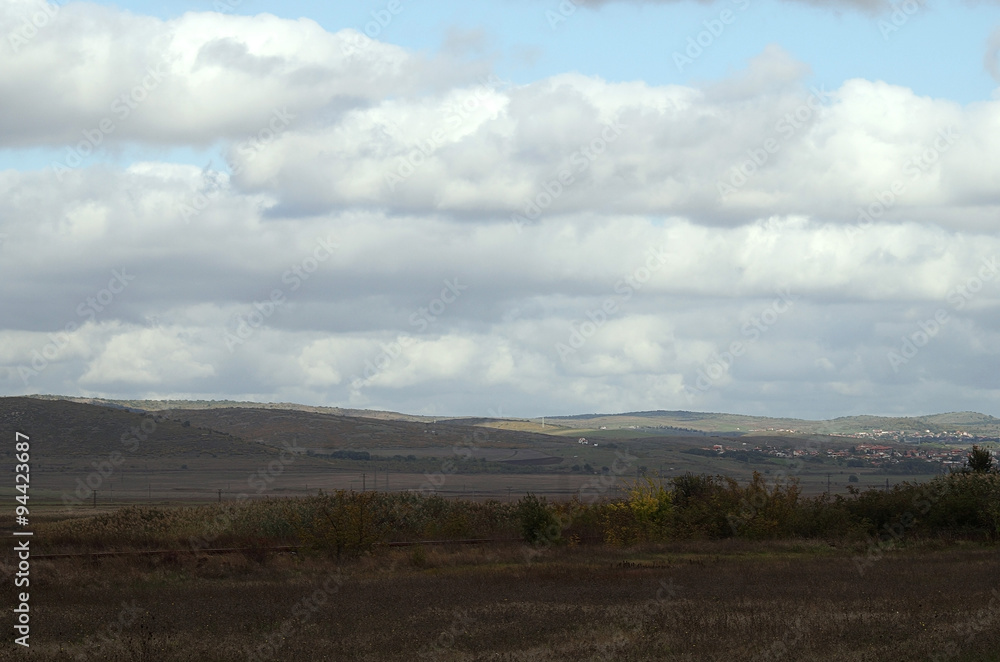 The sun illuminates the clouds over the valley