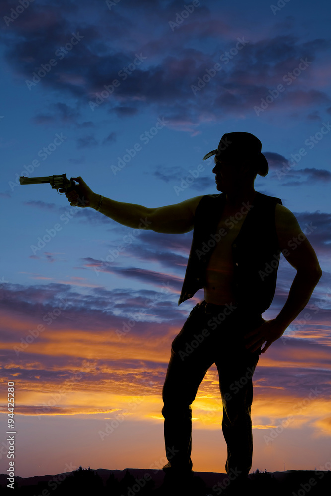silhouette of a cowboy with a pistol pointed to side