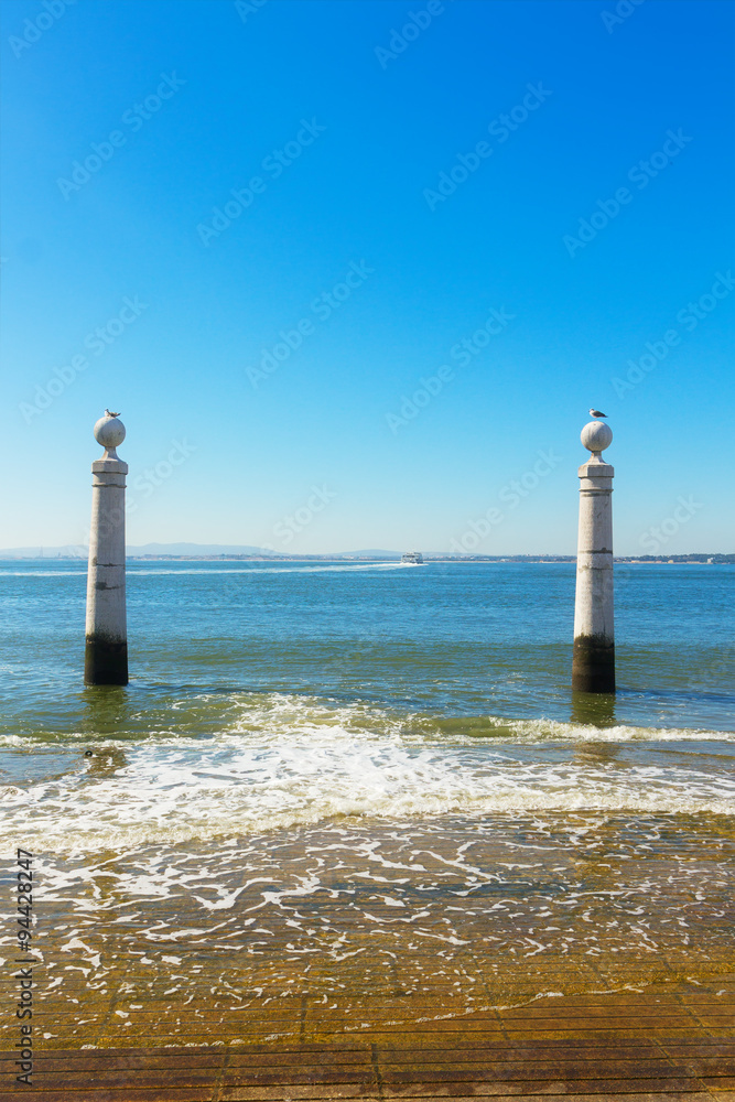 two posts at the embankment of Lisbon