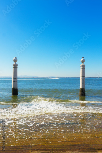 two posts at the embankment of Lisbon