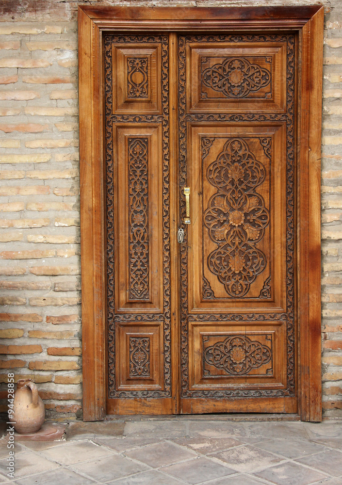 wooden decorated door with elegant carving