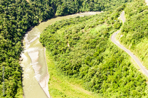 Explore the breathtaking beauty of the Pastaza River Valley in the Ecuadorian Andes with a high altitude,full size helicopter shot along the Pan American Road.