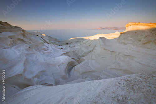 Coastal scenery with white volcanic rocks near Sarakiniko beach in Milos island, Greece.