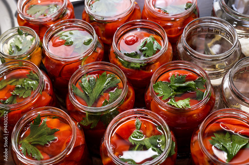  pickled red sweet peppers in a glass jar