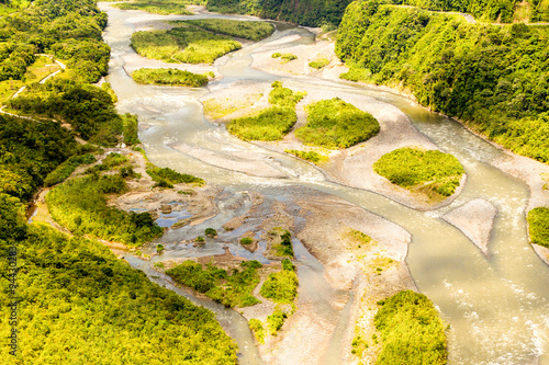 Experience the breathtaking beauty of the Pastaza River Basin with an awe inspiring aerial shot captured from a low altitude full size helicopter,perfect for an unforgettable adventure.