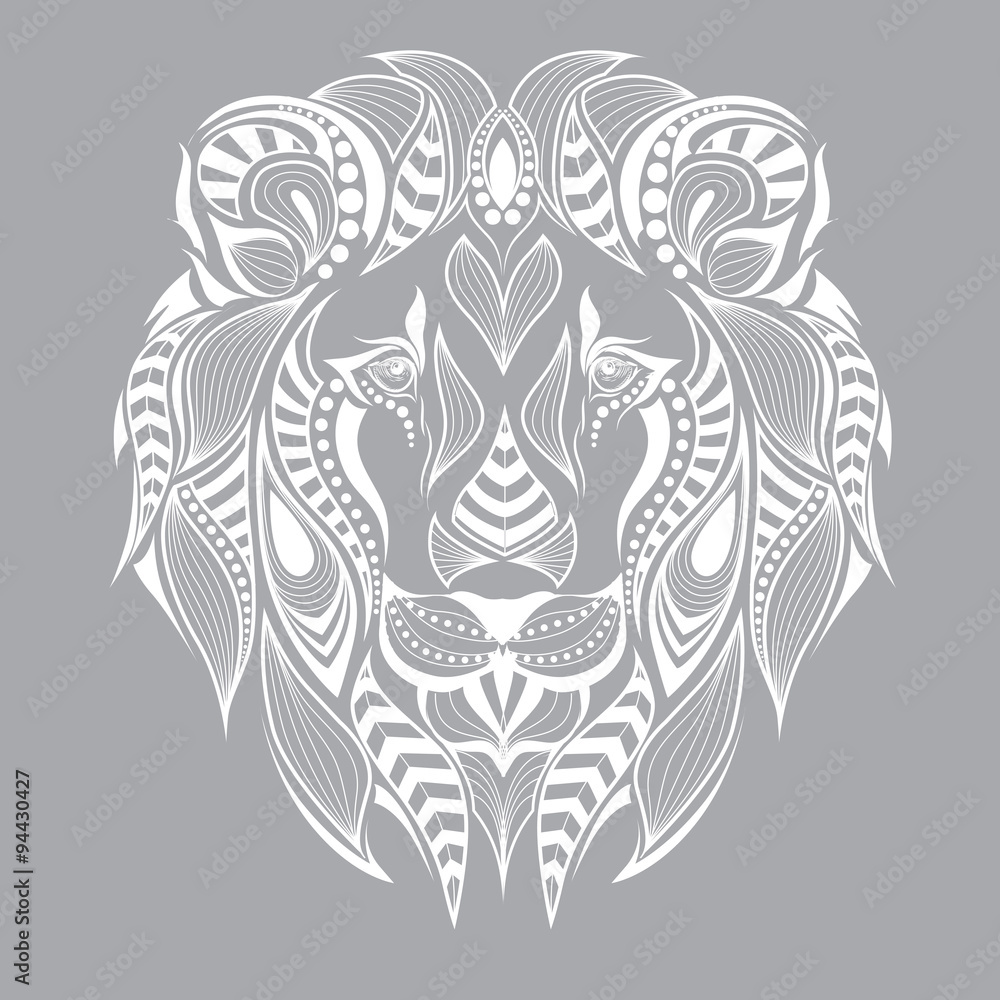 Fototapeta premium Patterned head of the lion on the grey background. African / indian / totem / tattoo design. It may be used for design of a t-shirt, bag, postcard and poster.