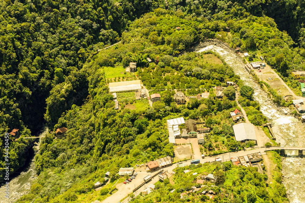 Experience the breathtaking beauty of Rio Verde Village nestled in the stunning Ecuadorian Andes,captured perfectly in this mesmerizing aerial shot.