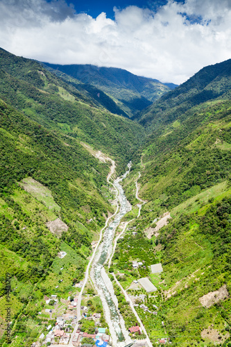 Capture the breathtaking beauty of Rio Blanco River as it flows out of Llanganates National Park in Tungurahua Province,Ecuador,with a mesmerizing high altitude helicopter shot.