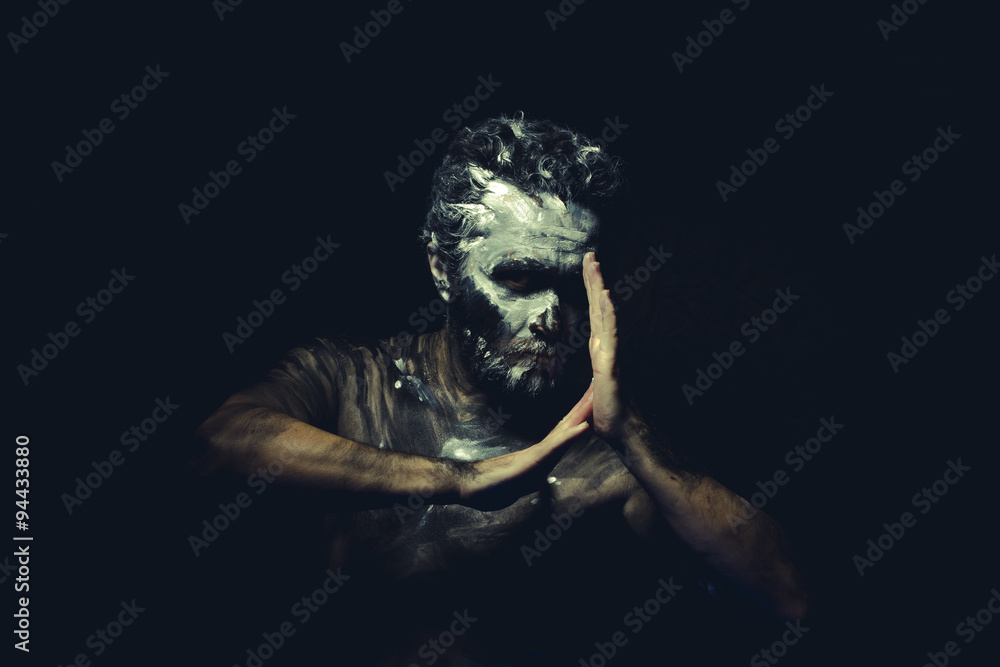 Culture, wild man with white painted face and full body black pa Stock ...