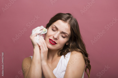 Woman with a bottle of lotion