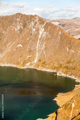 Explore the mesmerizing Quilotoa Crater lagoon situated in the Ecuadorian Andes within an inactive volcano offering a serene glimpse into the region's geological wonders
