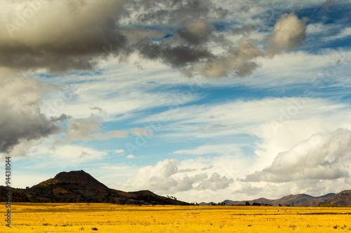 Witness the dramatic spectacle of heavy clouds enveloping the Ecuadorian Andes páramo situated above 4000 meters showcasing the atmospheric beauty of this high altitude landscape