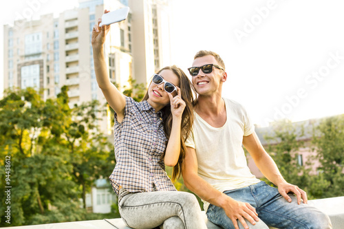 Girl and boy are outdoors at roof