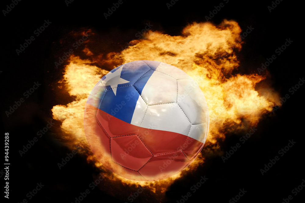 Fototapeta premium football ball with the flag of chile on fire