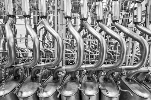 Tableau sur toile A galvanic steel muffler equipment with welded tailpipe and exhaust tube, designed for optimal engine performance and exhaust line flow