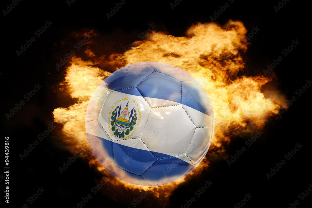 Fototapeta premium football ball with the flag of el salvador on fire