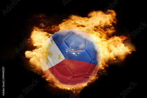 football ball with the flag of philippines on fire