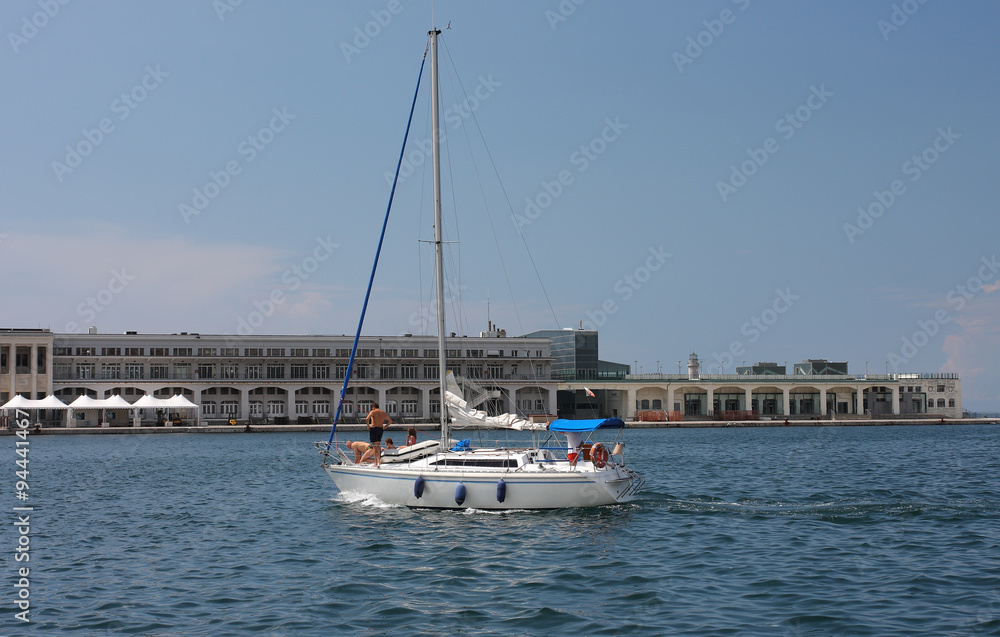 Sailboat arrives to harbor in Trieste, Italy