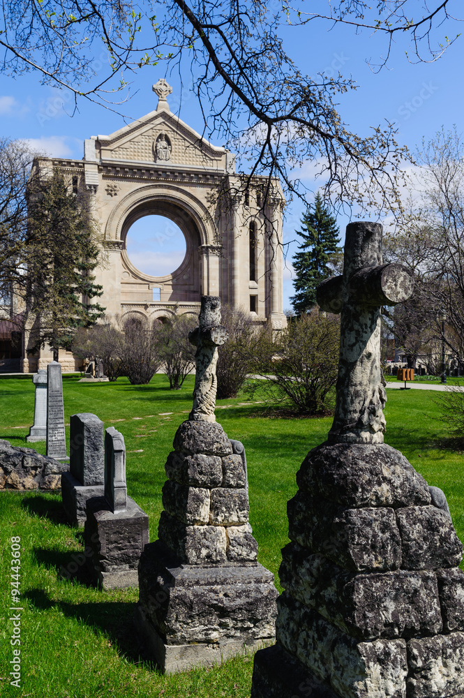 Fototapeta premium tombstones and St.Boniface cathedral, Winnipeg, Manitoba