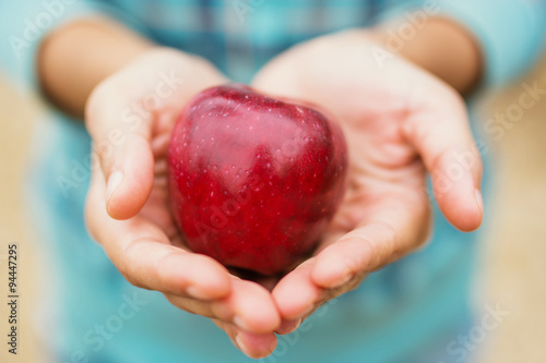 Photos Woman Holding a red apple