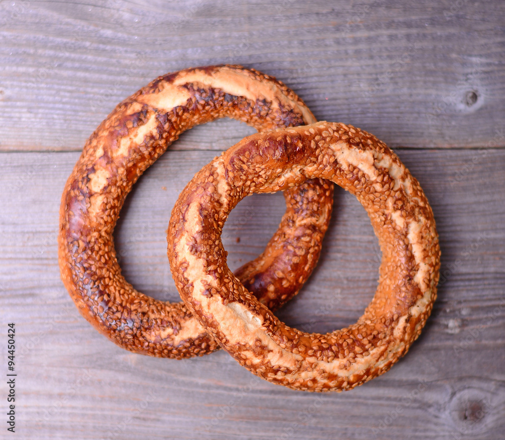 Fresh cook bagel on wooden background Fresh cook bagel on wooden background