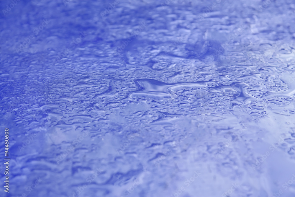 Obraz premium Blue surface with poured water