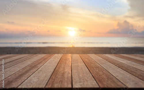 Top of wooden table at sunset beach. Can use for product display
