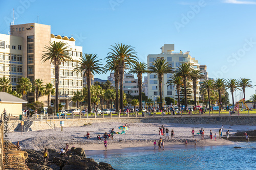 Local people and tourists in a beautiful day walking around the sea point area in Cape town, South Africa