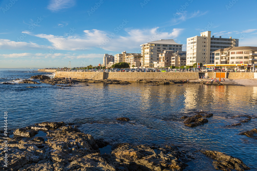 Local people and tourists in a beautiful day walking around the sea point area in Cape town, South Africa