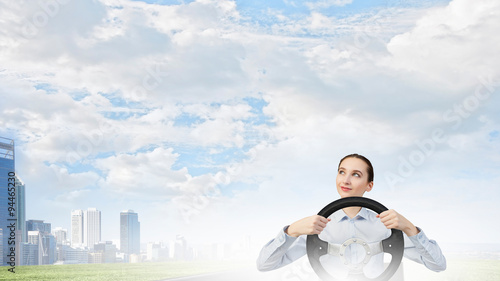 Woman with steering wheel