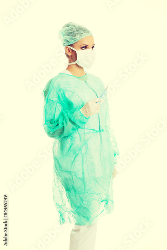 Female doctor with a scalpel