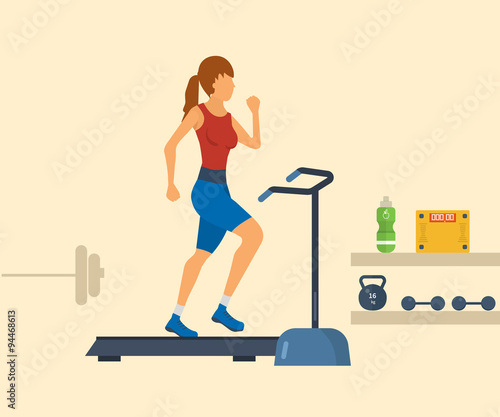 Young adult woman running on treadmill in fitness gym 