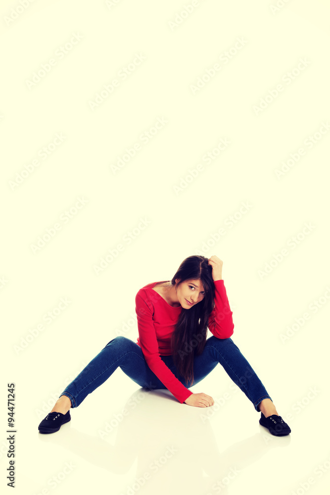 Depressed women sitting on the floor.