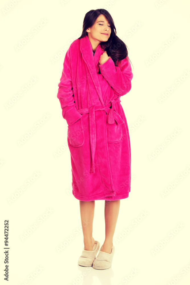 Beautiful woman in pink bathrobe. Beautiful woman in pink bathrobe.
