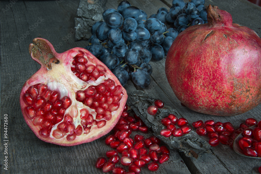 still life of pomegranates and grapes still life of pomegranates and grapes