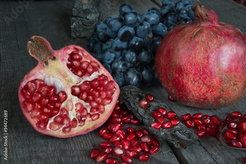 still life of pomegranates and grapes