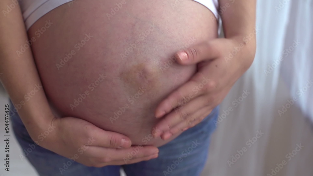 young pregnant girl 40 weeks term, stroking his belly and dreams, slow motion young pregnant girl 40 weeks term, stroking his belly and dreams, slow motion