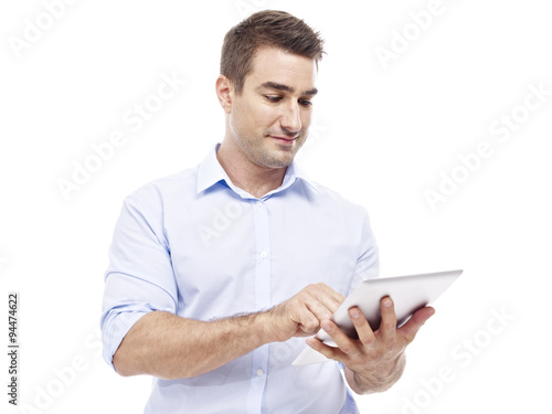 Obraz na płótnie caucasian businessman using tablet computer