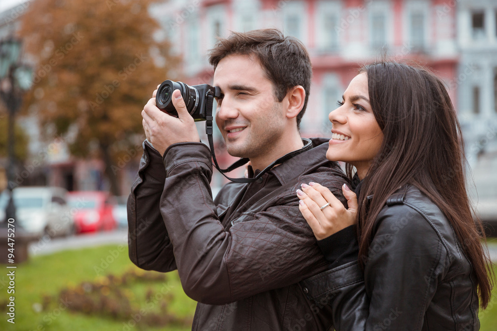 Couple traveling and making photo on camera Couple traveling and making photo on camera