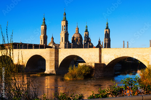 antique stone bridge and Cathedral in Zaragoza, Spain