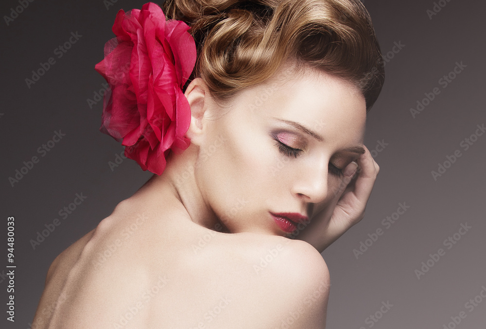 Portrait of beautiful girl with closed eyes and a red flower in her hair, closeup Portrait of beautiful girl with closed eyes and a red flower in her hair, closeup