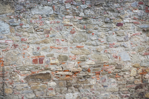 Antique street wall from bricks in Arezzo, Italy