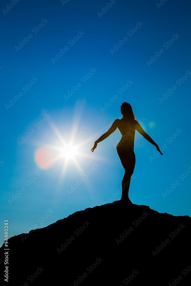 Silhouette of the sports women against the sky
